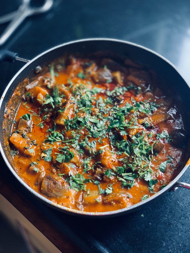 Skillet of chicken tikka masala.